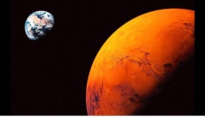 Planet Bumi dan Mars. Sumber gambar: www.telegraph.co.uk.